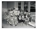 Alta Mortensen Hunter reading to a group of children