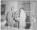 August Strand presenting an award at a football banquet held at the end of spring practice
