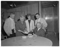 Students giving President and Mrs. Jensen a cake upon completing their first six months at OSU, Fall 1962