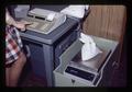 Nan Scott weighing grain sample, Oregon State University, Corvallis, Oregon, November 1977