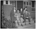 Foreign students at their new home, International Center, pictured with Austin Walter (in suit) foreign students' counselor, March 1953