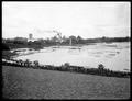 Carlton, OR., Consolidated Lumber Co. Sawmill from west, with large millpond in foreground. Smokestacks, water tank in background.