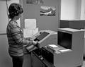 Student at microfiche machine