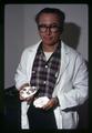 Willy Breese holding an oyster, Marine Science Laboratory, Oregon State University, Newport, Oregon, circa 1970
