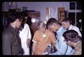 Dave Vasser, Don Klein, Robert Scambler, Wayne Bird, Fred Brown, Al McDowell examining laser instrument, Corvallis, Oregon, circa 1965