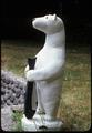 Polar bear with fish, 33 inches tall