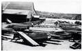 Lumber piled in front of mill