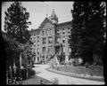 Main entrance, St. Mary's Academy, Portland. Landscaped grounds, arbor in foreground.