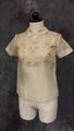Blouse of cream silk with pale brown embroidered, vined flowers on upper bodice and short sleeves