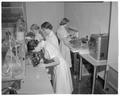 Home Economics students working in an experimental foods laboratory, March 1958