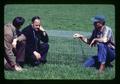 Lynn Cannon, Murray Dawson, and Bob Hiatt by cage, near Scholls, Oregon, circa 1970