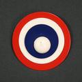 Pin of red, white and blue enameled metal in a concentric circle design