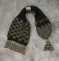 Purse of black cotton knit embellished with steel cut beads and silver droplet bead fringe