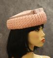 Hat of woven pink straw with pale mauve grosgrain ribbon bow