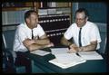 Dr. WIlliam G. Brown and Dr. Lyle Calvin looking at "An Economic Evaluation of the Oregon Salmon and Steelhead Sport Fishery", circa 1965