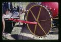 Raking wheel on field burner (thermal sanitizer), Oregon, June 1971