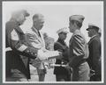 August L. Strand presenting certificate to USMC Cadet, circa 1951