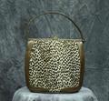 Handbag of bronzed leather with center panel of tiny leopard pattern fur