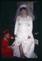 Betsy Slegel removing her garter at her wedding, 1965