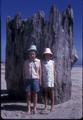 Two little kids in front of Big Stump, 3 miles south of Waldport, Wakonda Beach