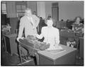 Mrs. Lavina Lynch Hunt learning about the telephone company's IBM machines in tabulating room, August 10, 1950