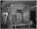 Professor A. D. Hughes of mechanical engineering and the mint distilling machine he developed, March 1951