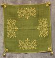 Table Scarf of green burlap worked in twisted yellow cotton in stylized vines with swirled ends at each of the four sides