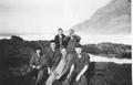 Photo of six unidentified CCC enrollees on the rocks near Cape Creek Camp.