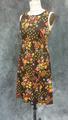 Dress of brown nylon jersey with a pattern of grouped, various flowers in white, yellow, pink, and orange