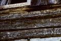 Wall section near gable showing chinking with wood strips