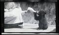 Irene Finley feeding a bear cub