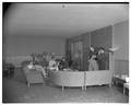 Students relaxing in the lounge of the new men's residence co-op, September 1954