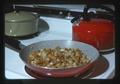 Fried potatoes in pan on stove, 1975