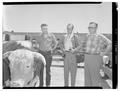 Dr. Alfred C. Kinsey, William Dellenback and Dr. F.F. McKenzie examine a bull