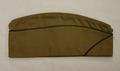 WWII Army Garrison Cap of tan cotton twill with black and gold braided pipe trim
