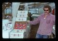 Desert Gem Farm manager Parker and tomatoes, Lakeview, Oregon, 1975