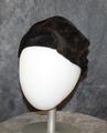 Turban-style hat of black-brown faux fur with crushed crown
