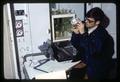 Honors Program student Roy Van Driesche examining unidentified sample in laboratory, Oregon State University, Corvallis, Oregon, circa 1969