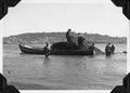 Loading seine on skiff