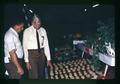 Oris Rudd and Ed Shannon judging exhibits, Jefferson County Fair, Madras, Oregon, August 1972