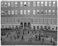 Student class change in front of Commerce Hall (Bexell Hall), November 1960