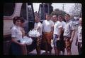 Oregon State University rugby team receiving gifts as they board a bus, circa 1965