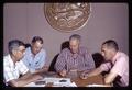 Horace Cheney, Stoney Jackson, T.J. Starker, and Russell Ellis looking at bark pellets, circa 1965