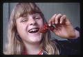 Strawberry picker holding Strawberry at Lewis Brown Farm, Corvallis, Oregon, 1973