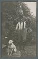 Arbuthnot and his dog with the day's catch of fish, circa 1910