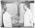 Selbi and Dr. Bollen with manure deodorizer, 1950