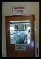 Fish tanks through window of door, Oregon State University, Corvallis, Oregon, circa 1970