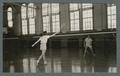 Badminton in the Women's Building, played by two women, 1940