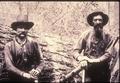 Two loggers in forest