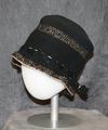 Cloche hat of black crochet with accents of gold threads